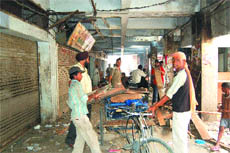 The Ghanta Ghar market being evacuated by shopkeepers in Amritsar on Tuesday.