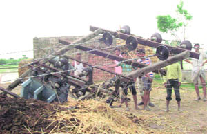 A transformer uprooted by a storm in Keorak village in Kaithal district on Tuesday.