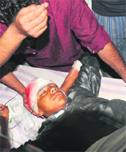 A youth, who was injured in clashes with the police, being treated in a hospital in Srinagar on Tuesday. 