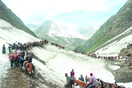 Pilgrims trudge along an arduous route to the Amarnath shrine in south Kashmir. 