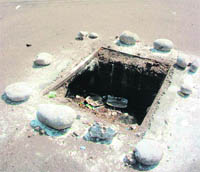 An open manhole which poses danger to residents of Shastri Nagar in Jammu. 