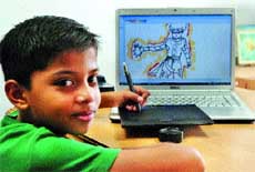 Prize winner of an international-level drawing competition, Ritvick Mehra draws a cartoon using a computer attachment at his home in Jalandhar.
