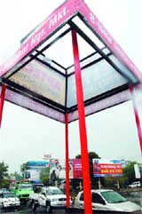 A traffic post without any cover on the top.
