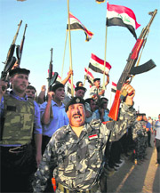 Iraqi security forces celebrate in Ramadi, capital of Anbar province, west of Baghdad on Monday. 