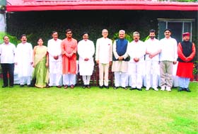 Governor BL Joshi and Chief Minister Ramesh Pokhriyal Nishank with the newly inducted ministers