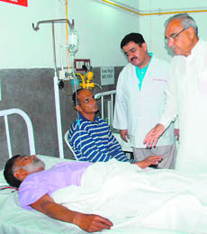 Haryana Chief Minister Bhupinder Singh Hooda inquires about the health of a patient at the Panchkula general hospital on Wednesday. 