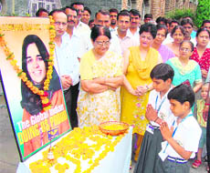 Schoolchildren and staff members of Tagore Bal Niketan Senior Secondary School pay tributes to astronaut Kalpana Chawla on her birth anniversary in Karnal on Wednesday.