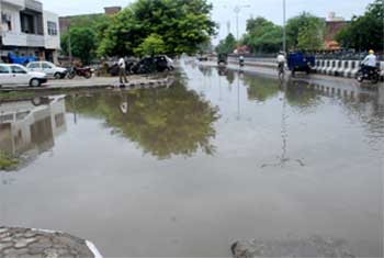 A view of the inundated Bathinda-Goniana road near the Rose Garden after rain lashed Bathinda