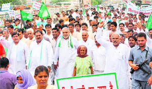 Activists of the INLD protest against the water and power crises in Gurgaon on Thursday.