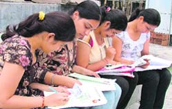 College students filling admission forms in Ludhiana