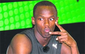 Double Olympic gold medallist Usain Bolt attends a sports science class at a school in south London