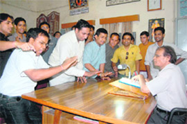   NSUI workers argue with DAV (PG) College principal in his office  in Dehradun on Friday. 