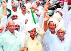 Activists of the BKU hold a protest against the shortage of power in Karnal on Friday.