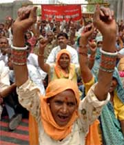 Employees of the municipal corporation stage a dharna in Gurgaon on Friday.