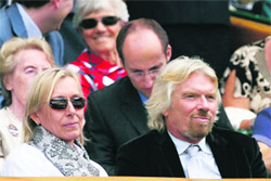 Martina Navratilova (L) and British business tycoon Richard Branson attend the womens final tennis match at the All England Club on Saturday. 