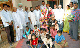 BJP workers celebrating the birth anniversary of Dr Mukherjee in the Viklang Sewa Ashram at Hanumangarh.