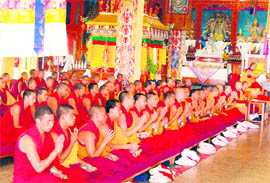 Monks paying obeisance on the occasion of Dalai Lamas birthday at a monastery in Dharamsala on Monday.