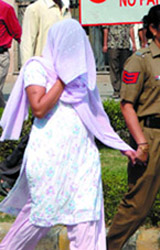 Dr Rupa Kopari, who allegedly poisoned her twin daughters, being produced at Rohini court in New Delhi on Tuesday.