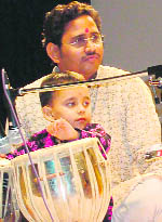 Four-and-a-half-year old Ananya on tabla.