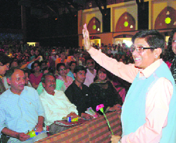 Kiran Bedi waving to the audience at the Gaiety Theatre where she delivered a lecture on domestic violence in Shimla on Tuesday.