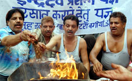Residents perform havan for appeasing the rain gods in Amritsar on Wednesday.