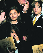 Michael Jacksons daughter Paris (left) and two sons Prince Michael Jackson II and Prince Michael Jackson I (right) wave at the end of the memorial service for their father at Staples Center in Los Angeles on Tuesday.
