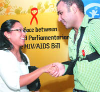 Union minister of state for rural development Agatha Sangma with cricketer Virender Sehwag at an HIV/AIDS programme in New Delhi on Thursday.