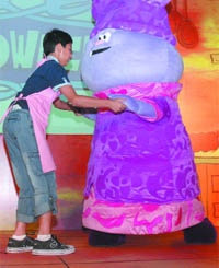 A boy enjoys at the launch of animated series 'Chowder' on Cartoon Network in New Delhi on Thursday.