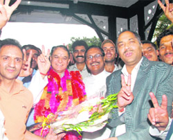Jai Ram Thakur and Mohinder Singh after taking oath as Cabinet ministers with in charge of state affairs Satya Pal Jain at Shimla on Thursday.  