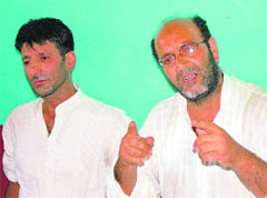 Family members of Asrar Mushtaq Dar address the media in Srinagar on Thursday.