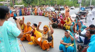 Members of the Anganwari Workers Union, Punjab, staging a dharna and road blockade near the Mini-Secretariat in Bathinda 