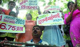 Members of Surbhi Parivar, an NGO, demonstrate on the occasion of World Population Day at Jantar Mantar in New Delhi