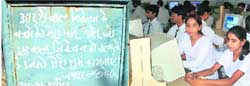 The blackboard on which Pt Jawahar Lal Nehru wrote his best wishes for the children and staff of the school; and (right) students in the computer lab.