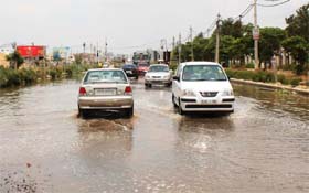 Monsoon Mirage: An overflowing sewer line leaves a road waterlogged in Sector 45, Gurgaon