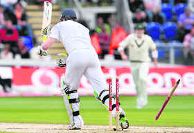 England batsman Kevin Pietersen is bowled by Australian paceman Ben Hilfenhaus on the final day of the first Ashes Test on Sunday.
