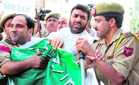 The police detains separatist leaders Shahid Ului-Islam and Javed Mir in Srinagar on Monday.