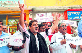 Kashmiri Pandits protest in support of their demand for jobs for unemployed youths in Jammu on Monday.