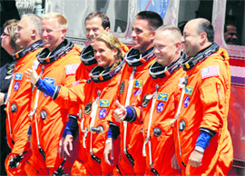 Crew of space shuttle Endeavour STS-127 waves before heading to the pad at the Kennedy Space Centre, at Cape Canaveral. Endeavour is on a 16-day mission to the International Space Station.