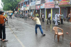 Making the most of the bandh, shopkeepers play cricket at the Fish Market in Bathinda on Tuesday.