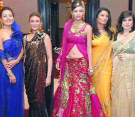 Designers with models during a press preview of Bridal Asia-09 in New Delhi on Tuesday.