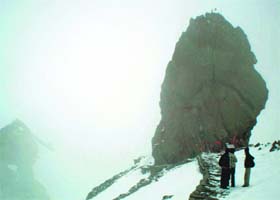 The giant natural rock resembling Shiva Lingam atop the Shrikhand peak