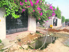The incomplete drain in front of the house of Mr BL Dhar in Durga Nagar Enclave, Sector 1, ward no. 64, in Jammu.