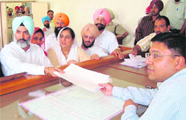 Deepinder Singh, Congress candidate from Banur, files his nomination papers before returning officer Puneet Goyal at Dera Bassi on Tuesday. 