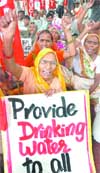 SUC activists protest against price hike of basic commodities at ITO in New Delhi 