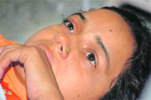 Rajni Bala, whose newborn son was stolen from a hospital, wails as the police has failed to trace the baby.