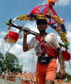 A kanwaria returns to Gurgaon from Haridwar on Thursday.
