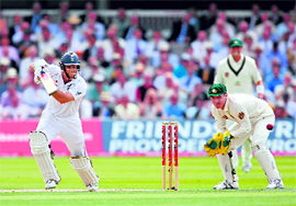 Andrew Strauss (L) plays a shot watched by Brad Haddin (R) during the first day of the second Ashes Test at Lords on Thursday.