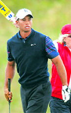 Tiger Woods looks at his shot off the tenth tee during the first round of the British Open in Scotland on Thursday.