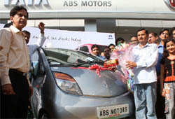 The first Nano car being delivered to Satish Kumar of Nakhrolla village in Gurgaon on Saturday.