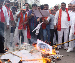 Activists of the Akhil Bharatiya Brahman Samaj burn pictures of UP Chief Minister Mayawati in Gurgaon on Saturday.